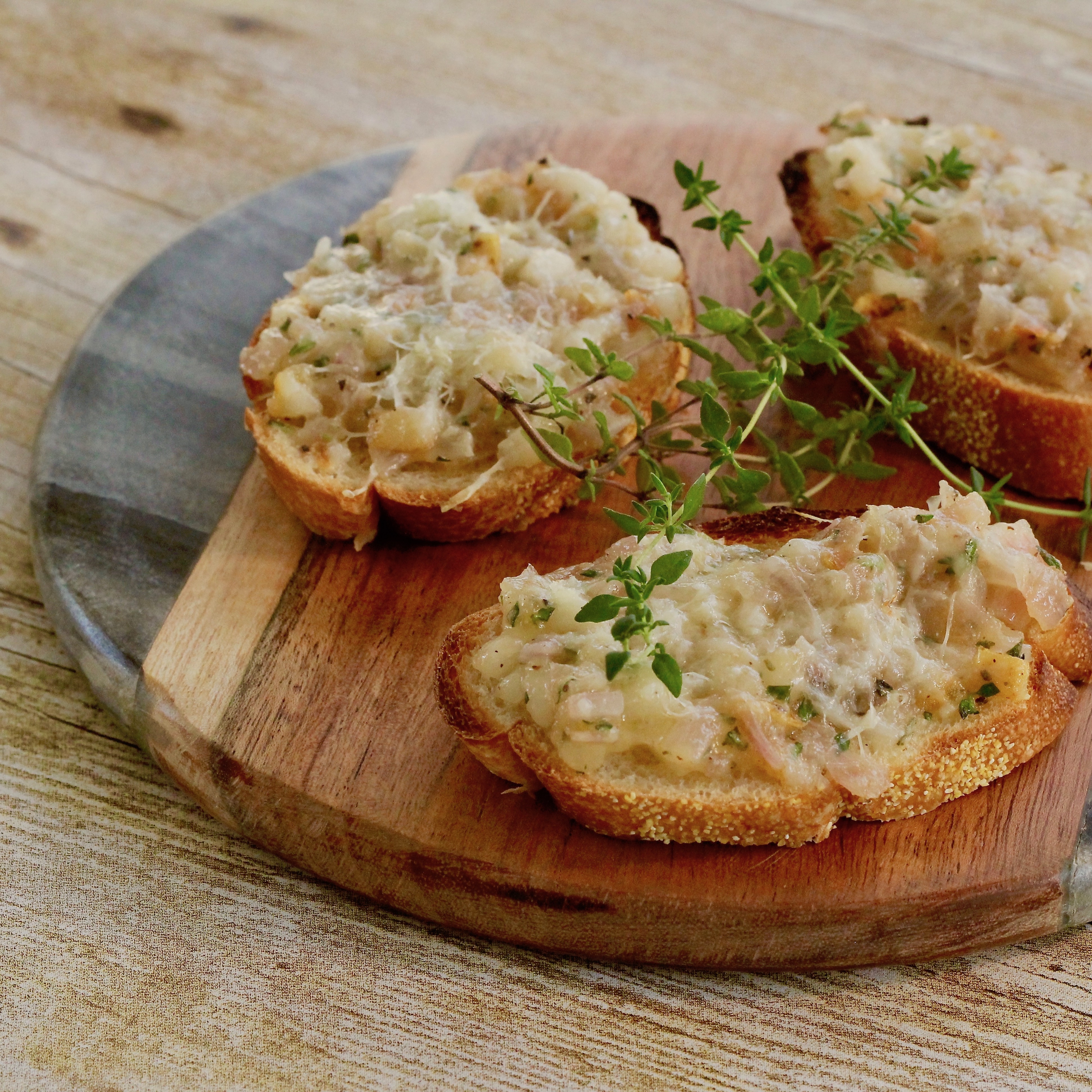 Crostini with Pear, Parmesan, and Caramelized Shallots