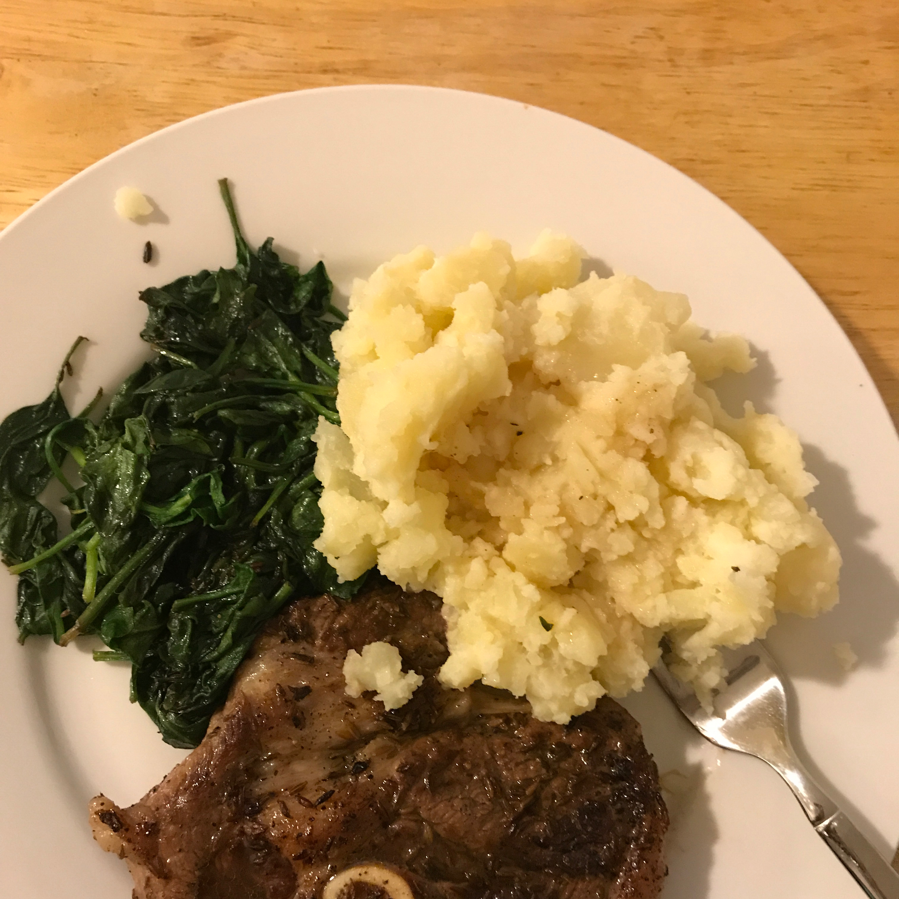 Cumin Lamb Steaks with Smashed Potatoes, Wilted Spinach and Red Wine Sauce