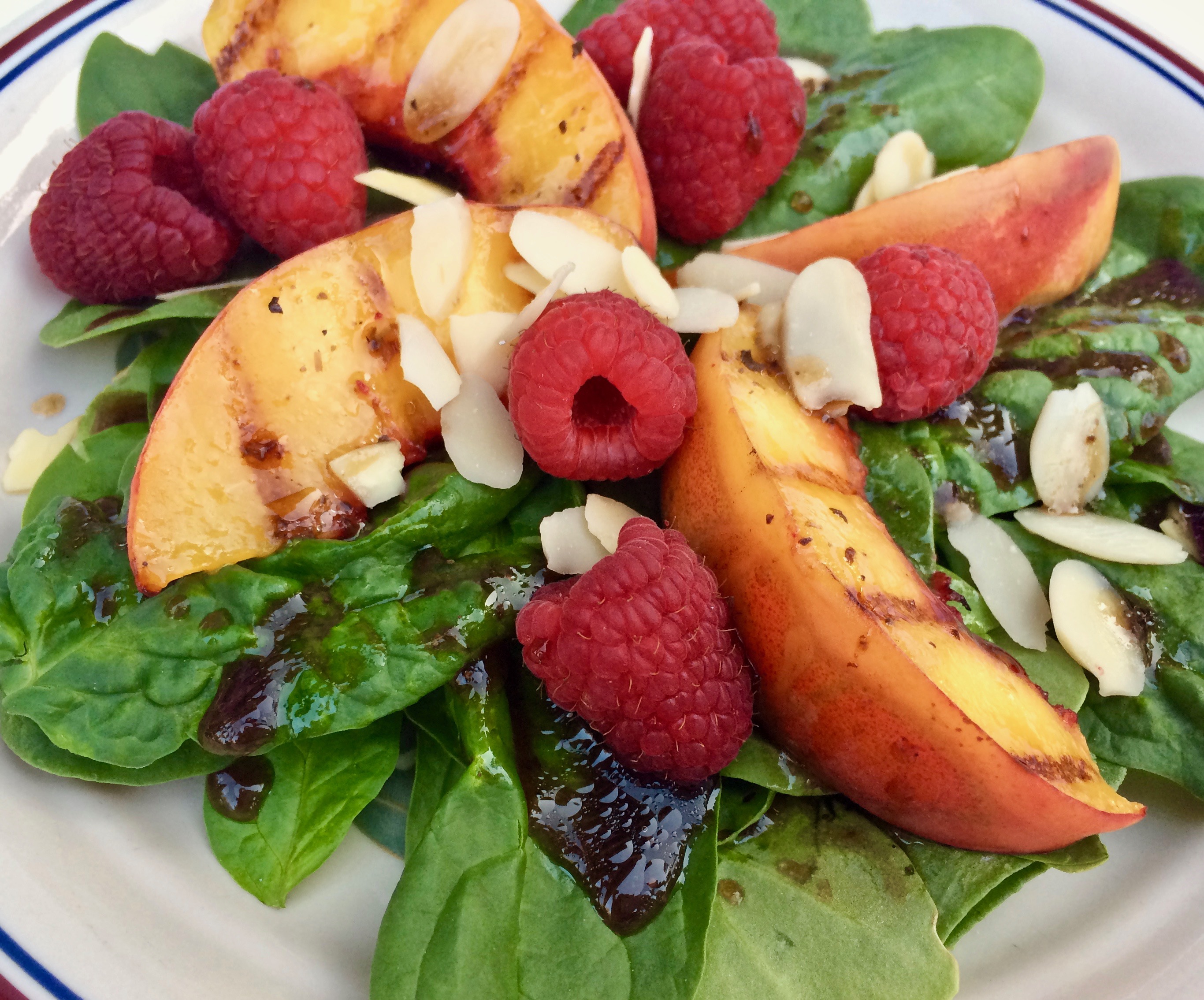 Grilled Peach Salad with Spinach and Raspberries