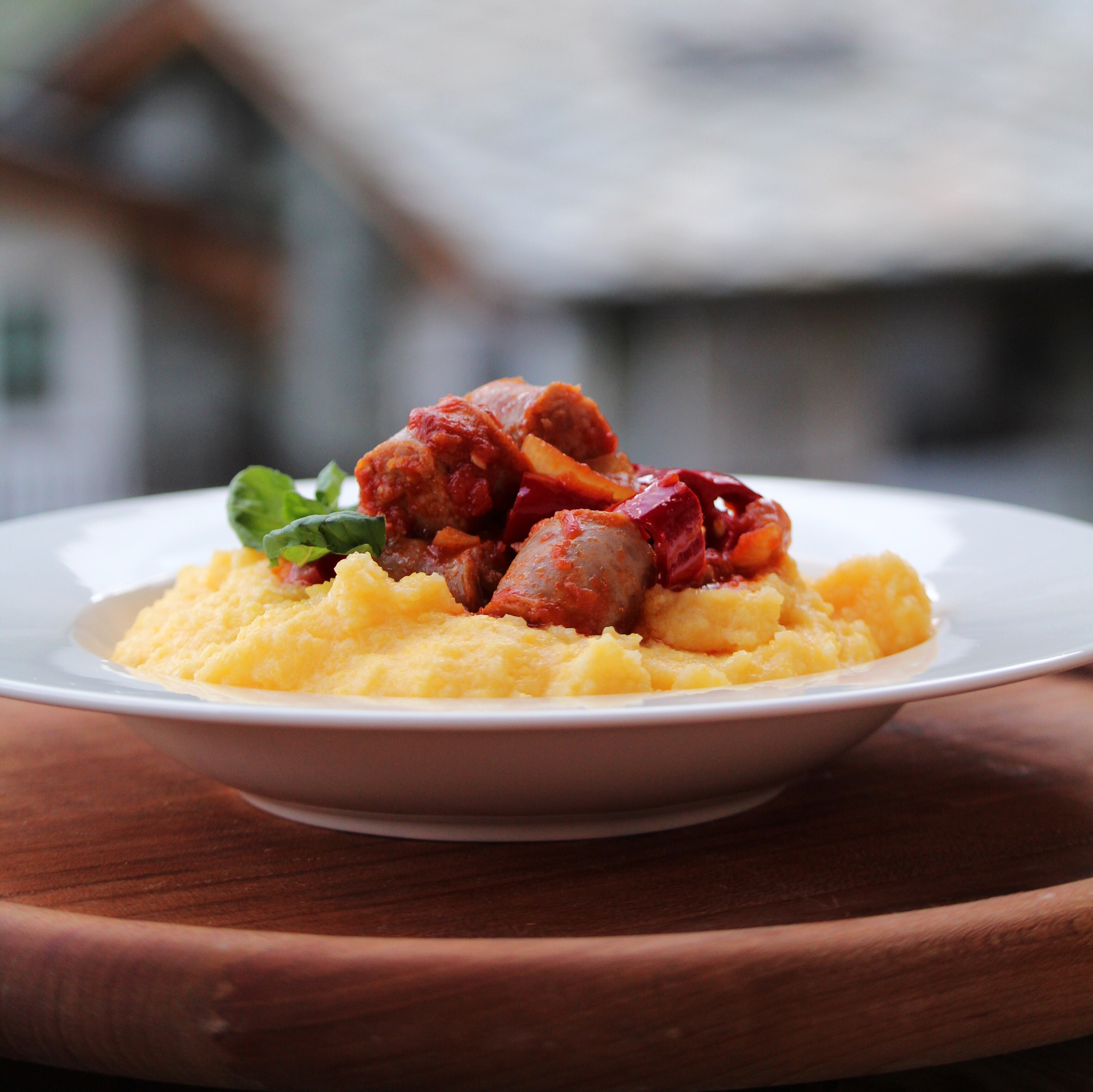 Sausage and Peppers over Creamy Parmesan Polenta